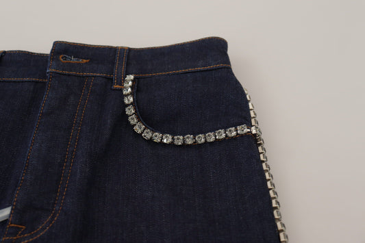 Blue denim jeans with silver zipper and crystal embellishment on front pocket