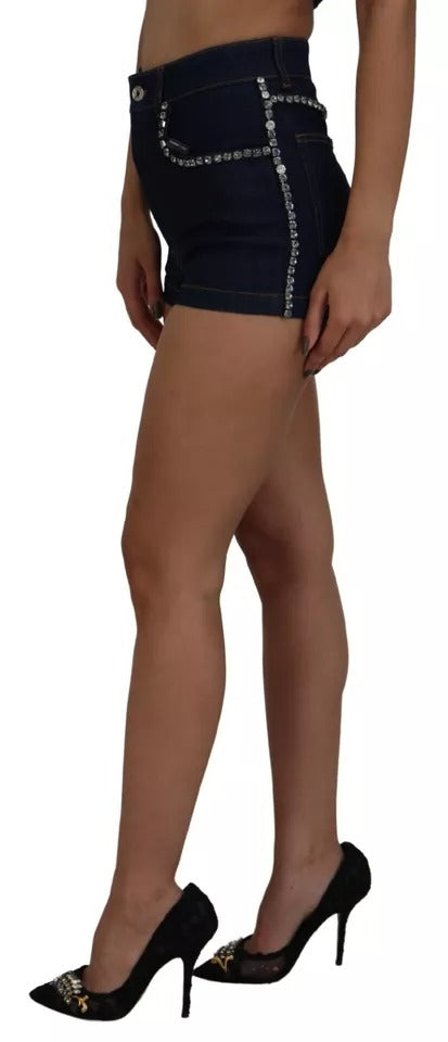 A pair of blue denim stretch crystal hot pants shorts with a high waist and rhinestone embellishments