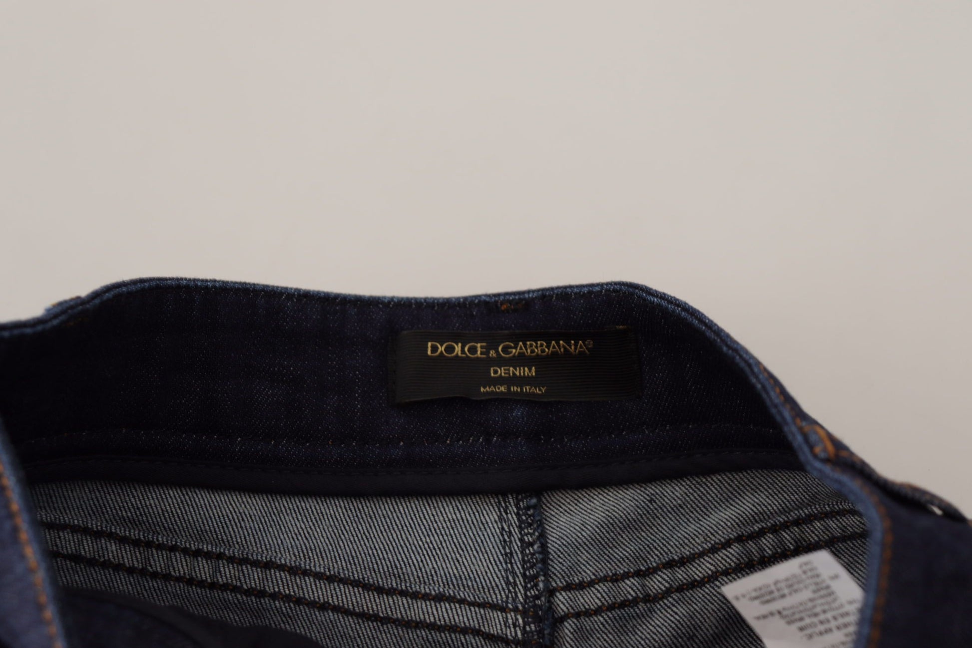 Blue denim jeans with brand label on waistband