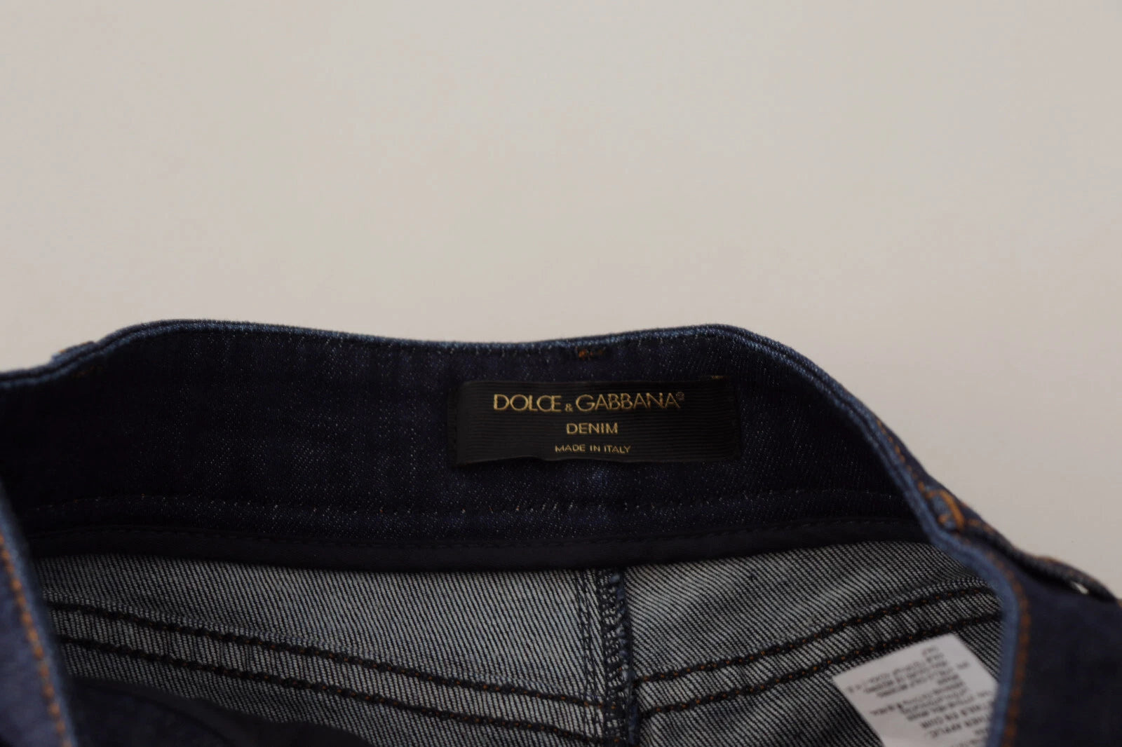 Blue denim jeans with a tag on the waistband