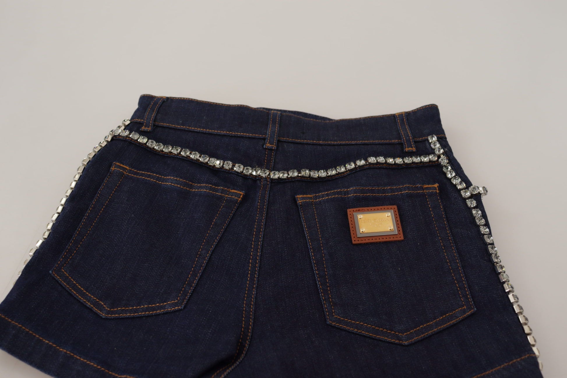 Pair of blue denim shorts with rhinestones on belt loops