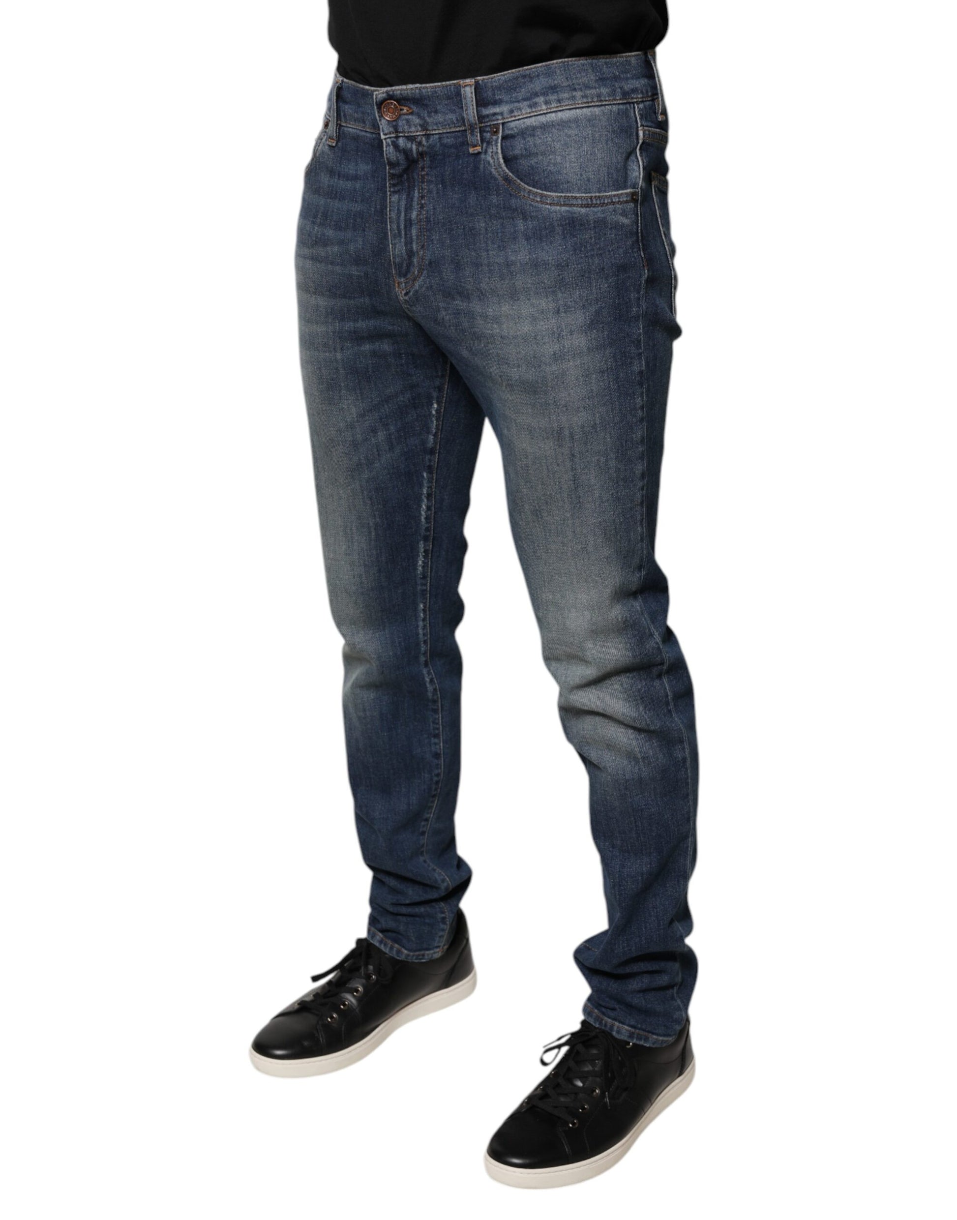 Man wearing blue jeans and black shoes