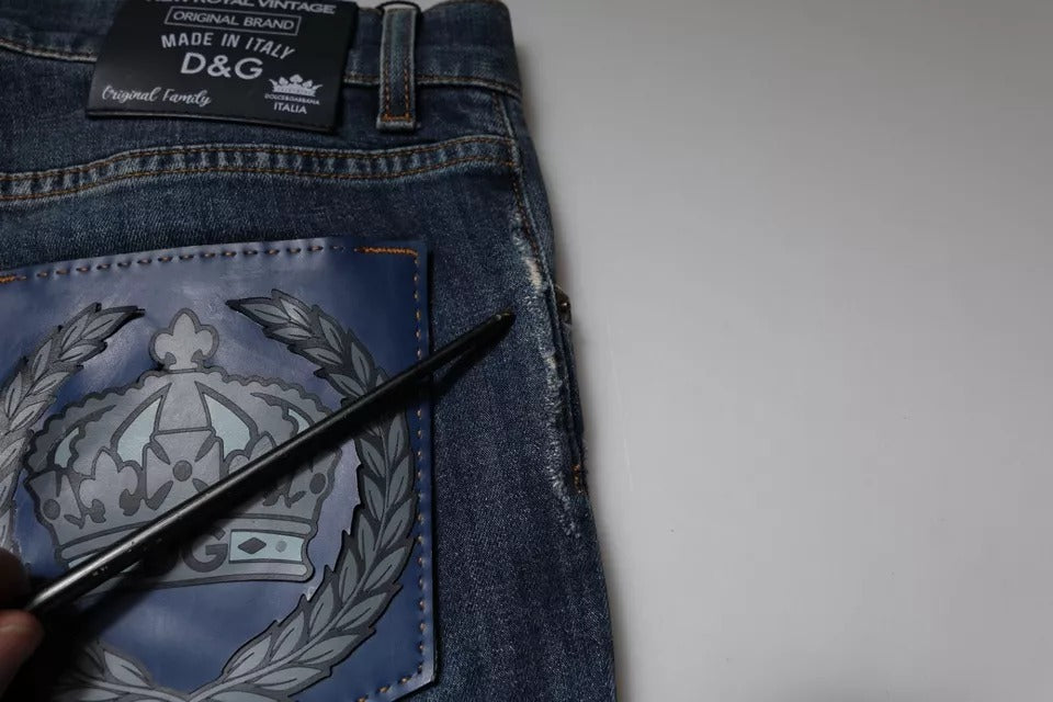 Pair of blue jeans with embroidered emblem on back pocket