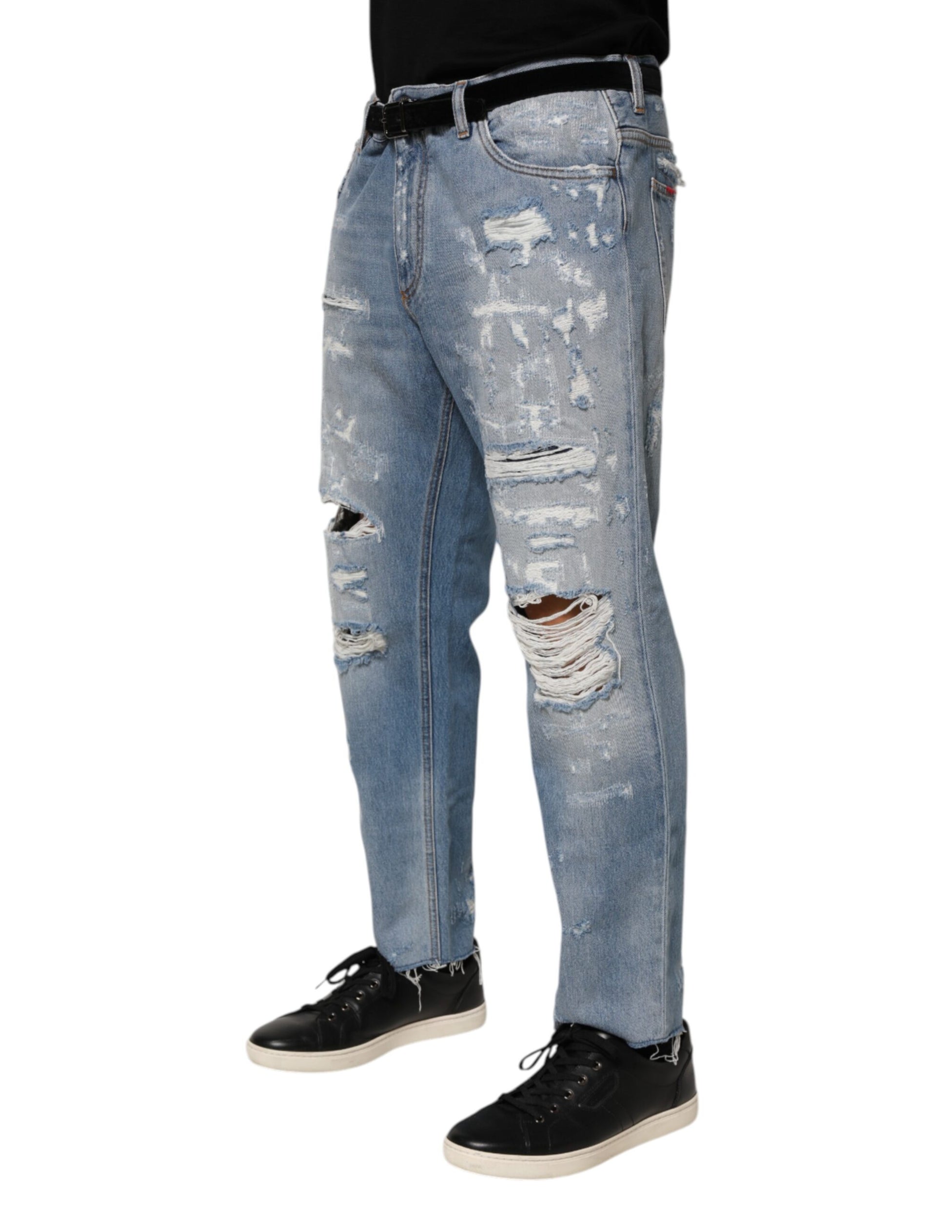 Pair of distressed blue jeans with rips and tears