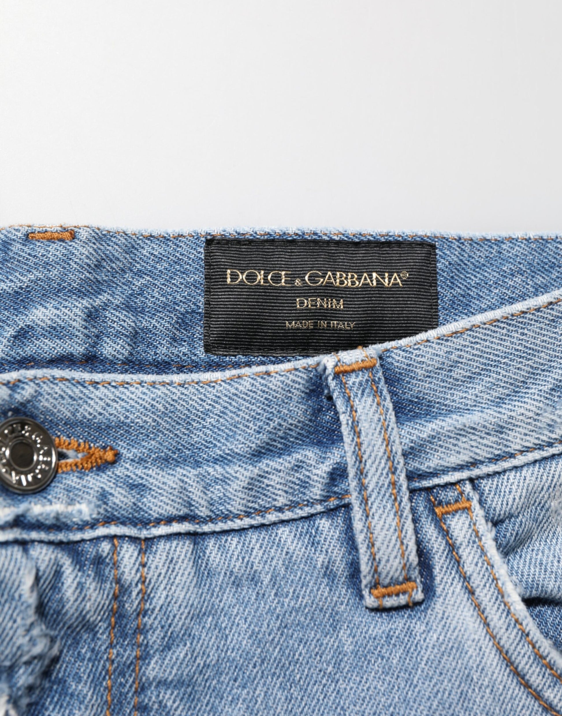 Blue denim jeans with brand label on waistband