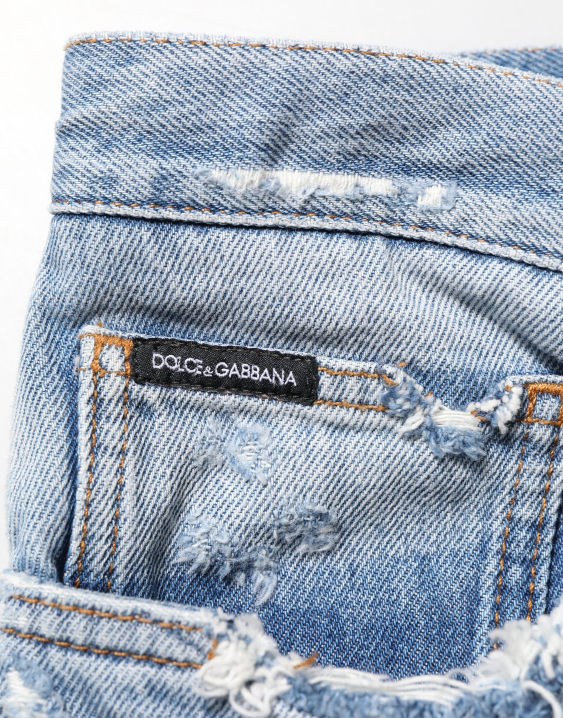 Blue denim jeans with brand label on waistband