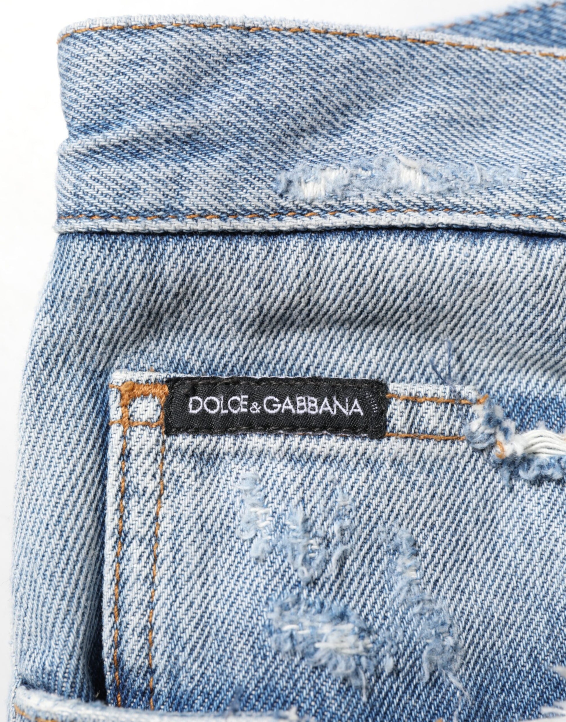 Blue denim jeans with brand label on waistband