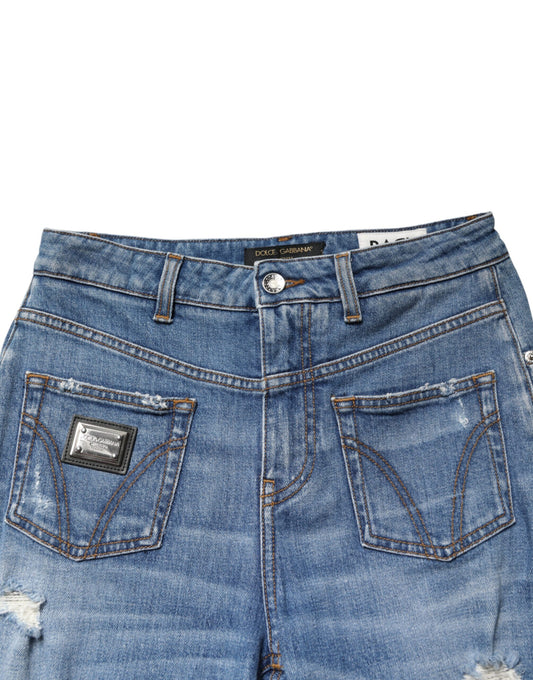 Blue denim shorts with distressed details