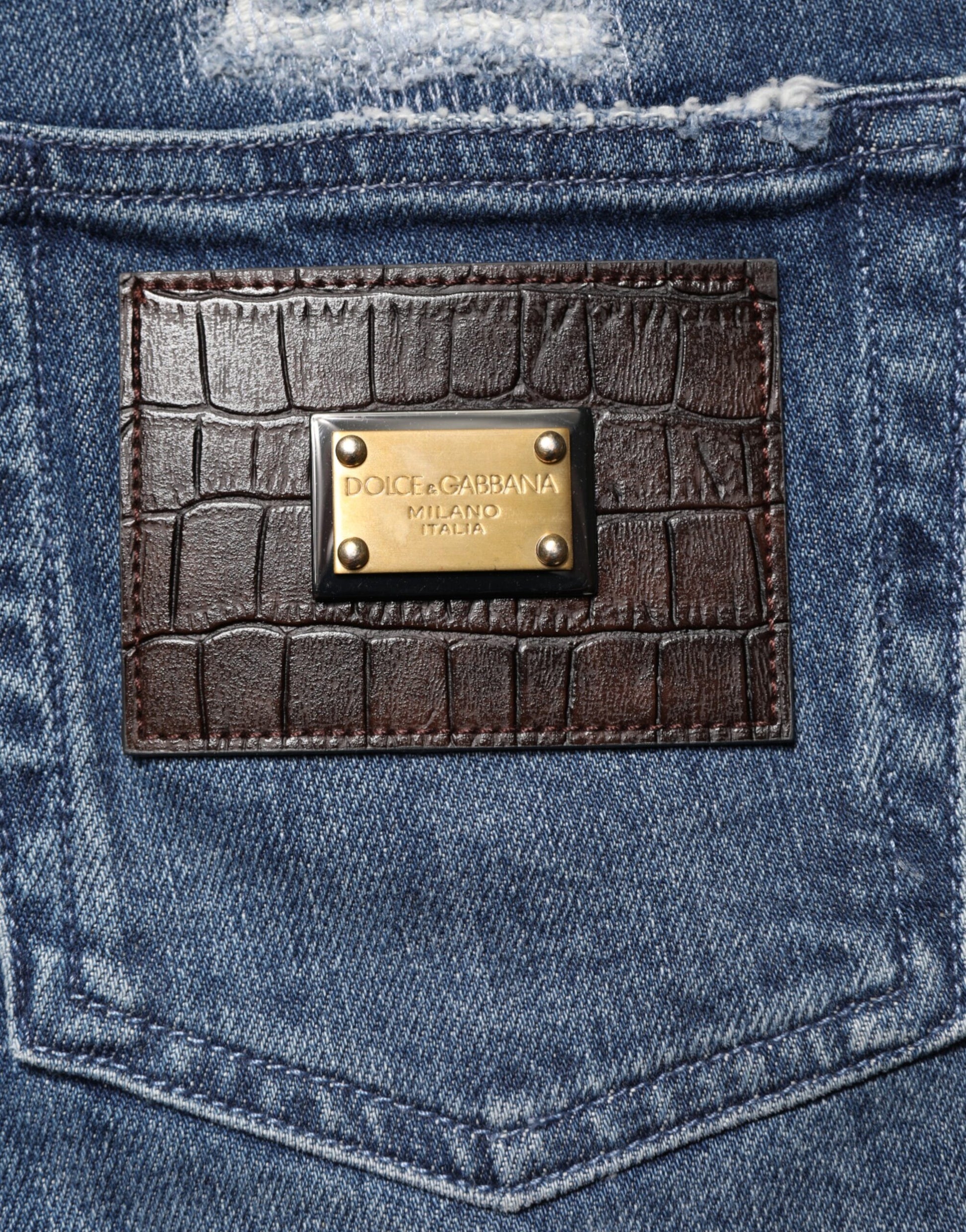 Brown leather belt loop on blue jeans
