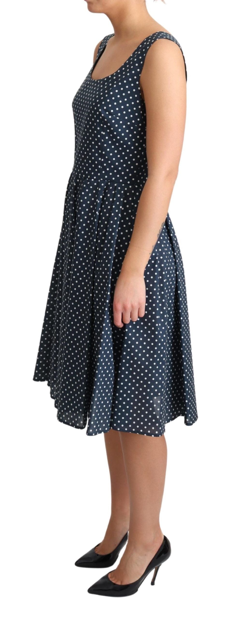 A-line dress with polka dots, blue color, cotton fabric, and a fitted waist