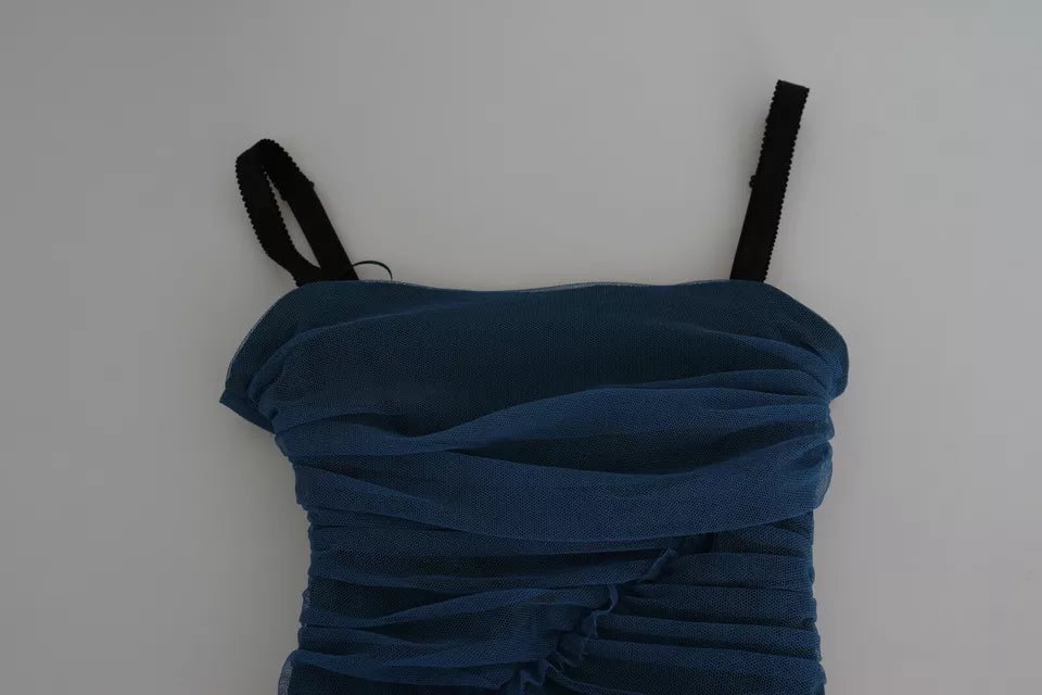 A blue dress with draped tulle sleeves and a midi length