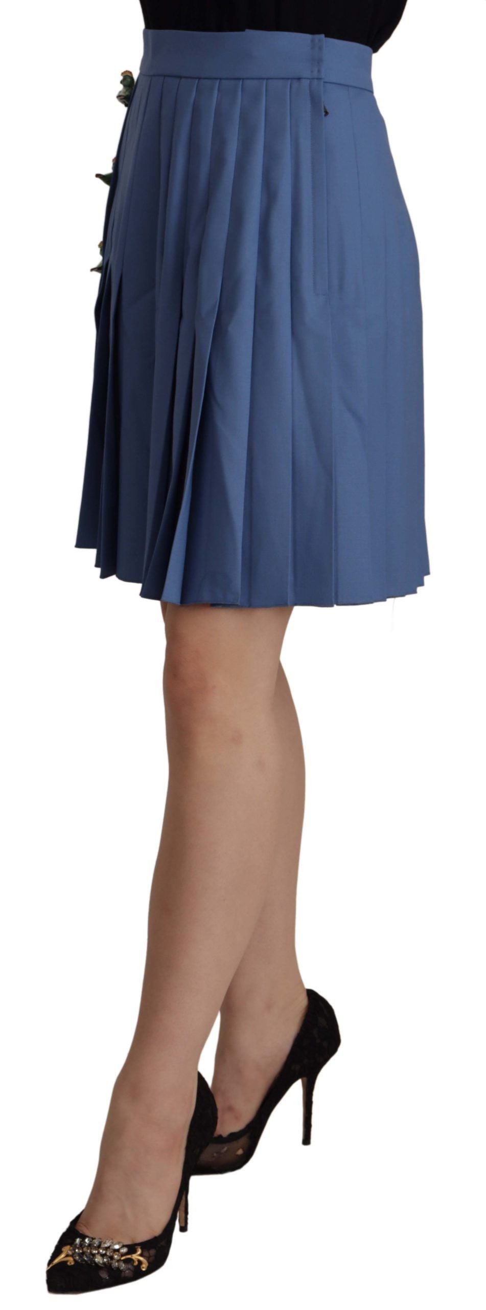 Blue pleated skirt worn by a woman