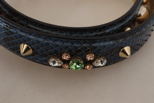 Blue snake skin belt with gold studs and green gemstones