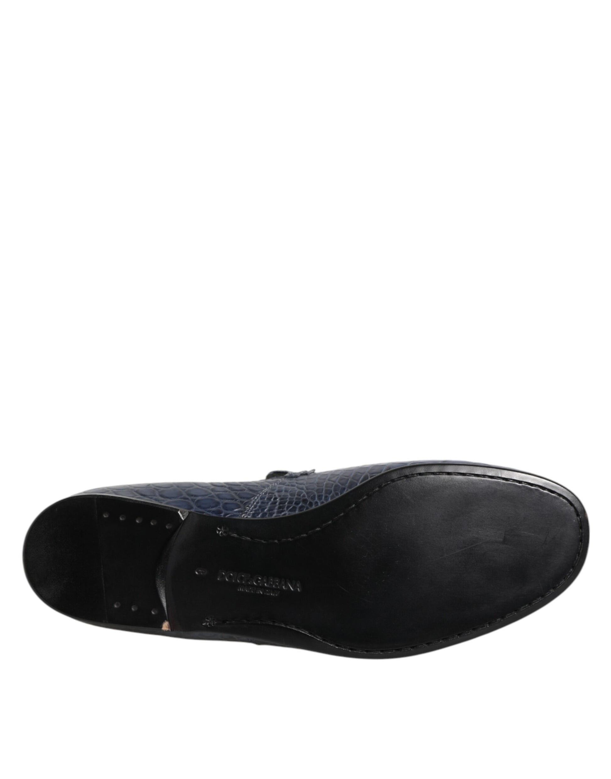 A pair of blue exotic leather slip on loafers for men
