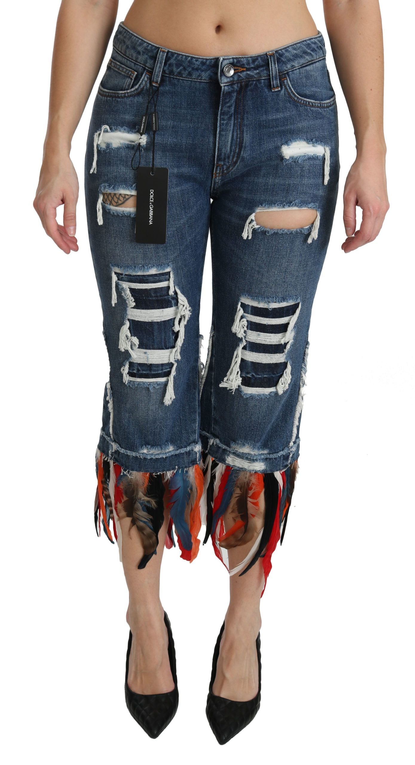 Pair of distressed denim jeans with fringe detailing