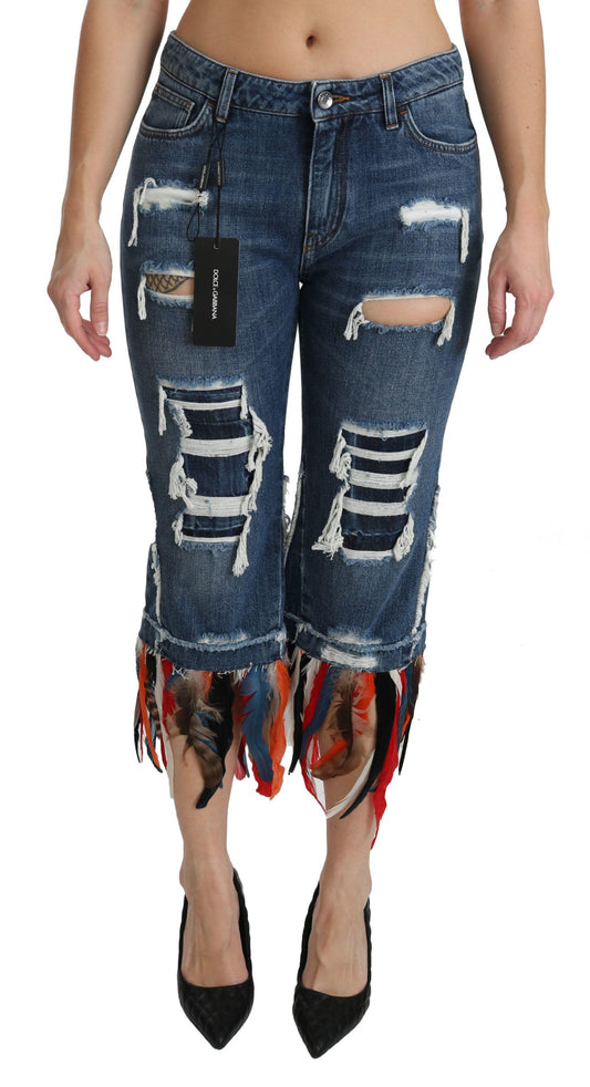 Pair of distressed denim jeans with fringe detailing