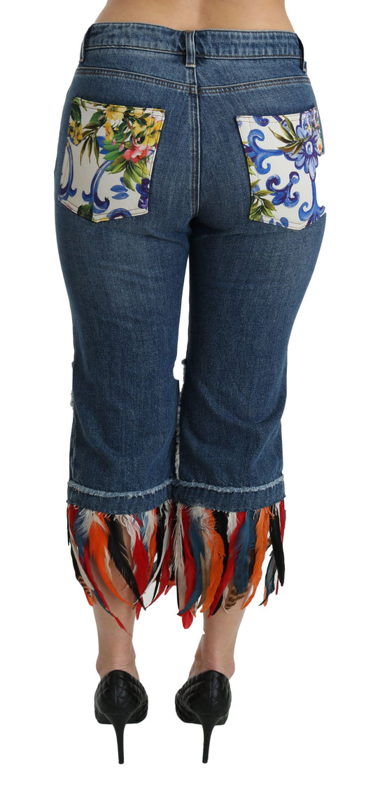 Pair of women's jeans with floral pattern on back and fringe detailing at bottom