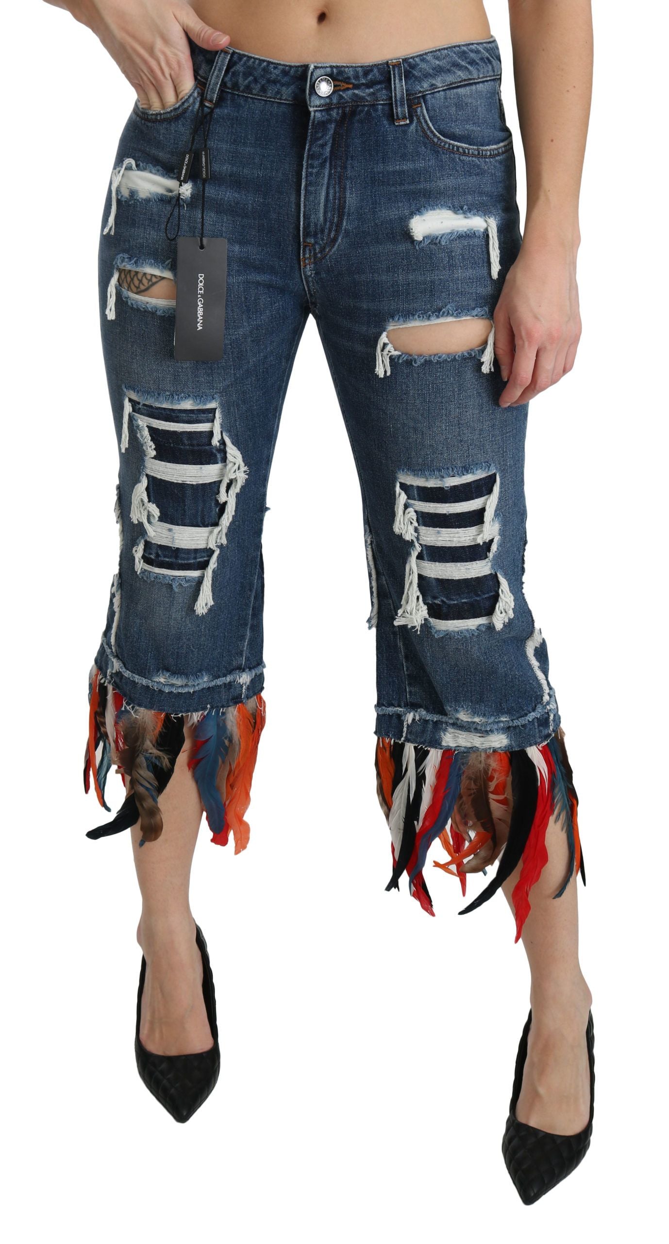 Woman wearing distressed denim jeans with fringe detailing