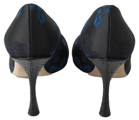 Pair of black high heel shoes with blue pattern on toe