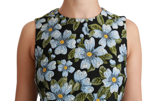 A black dress with blue flowers and yellow centers, featuring a brocade pattern