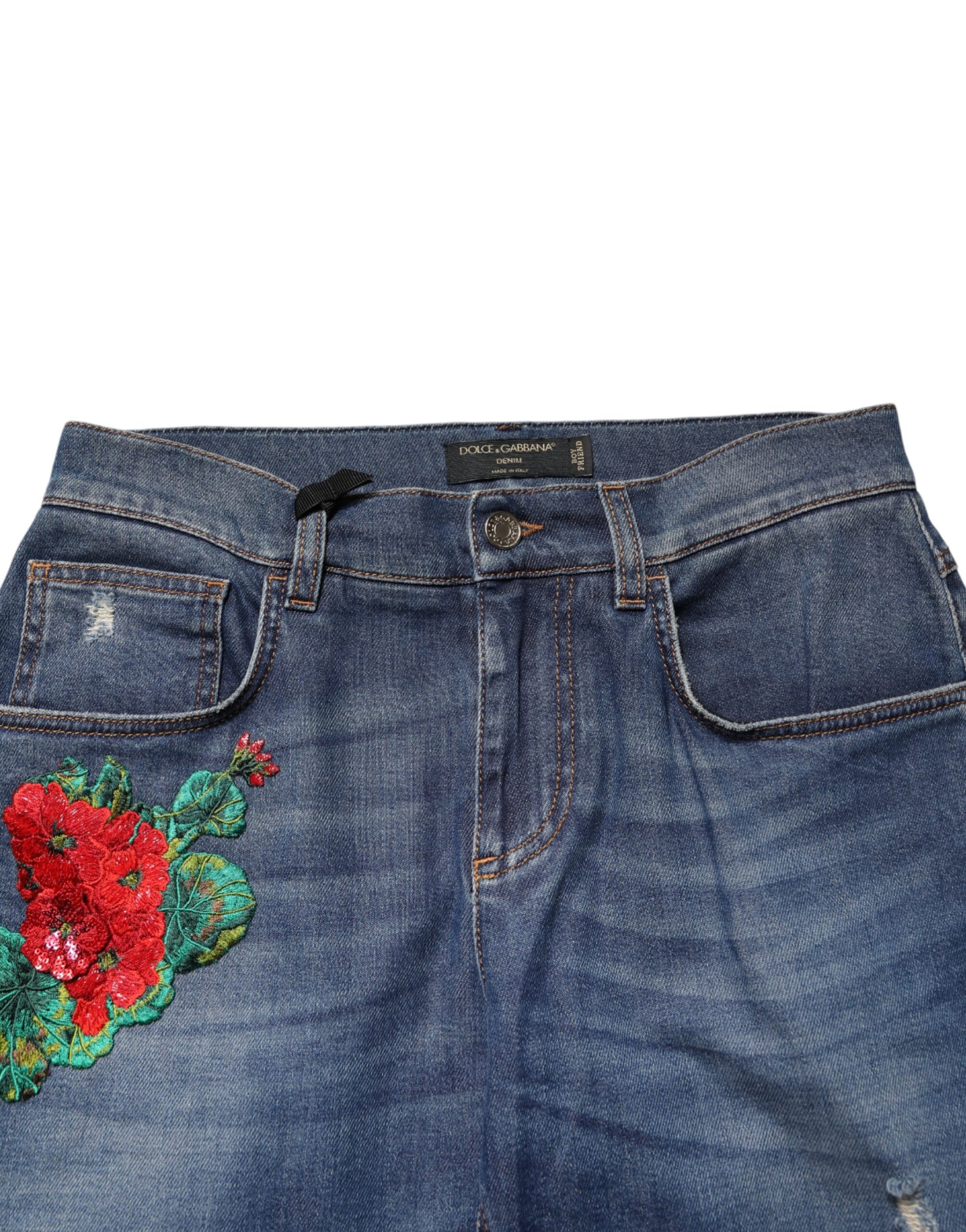 Blue denim jeans with floral embroidery on front leg