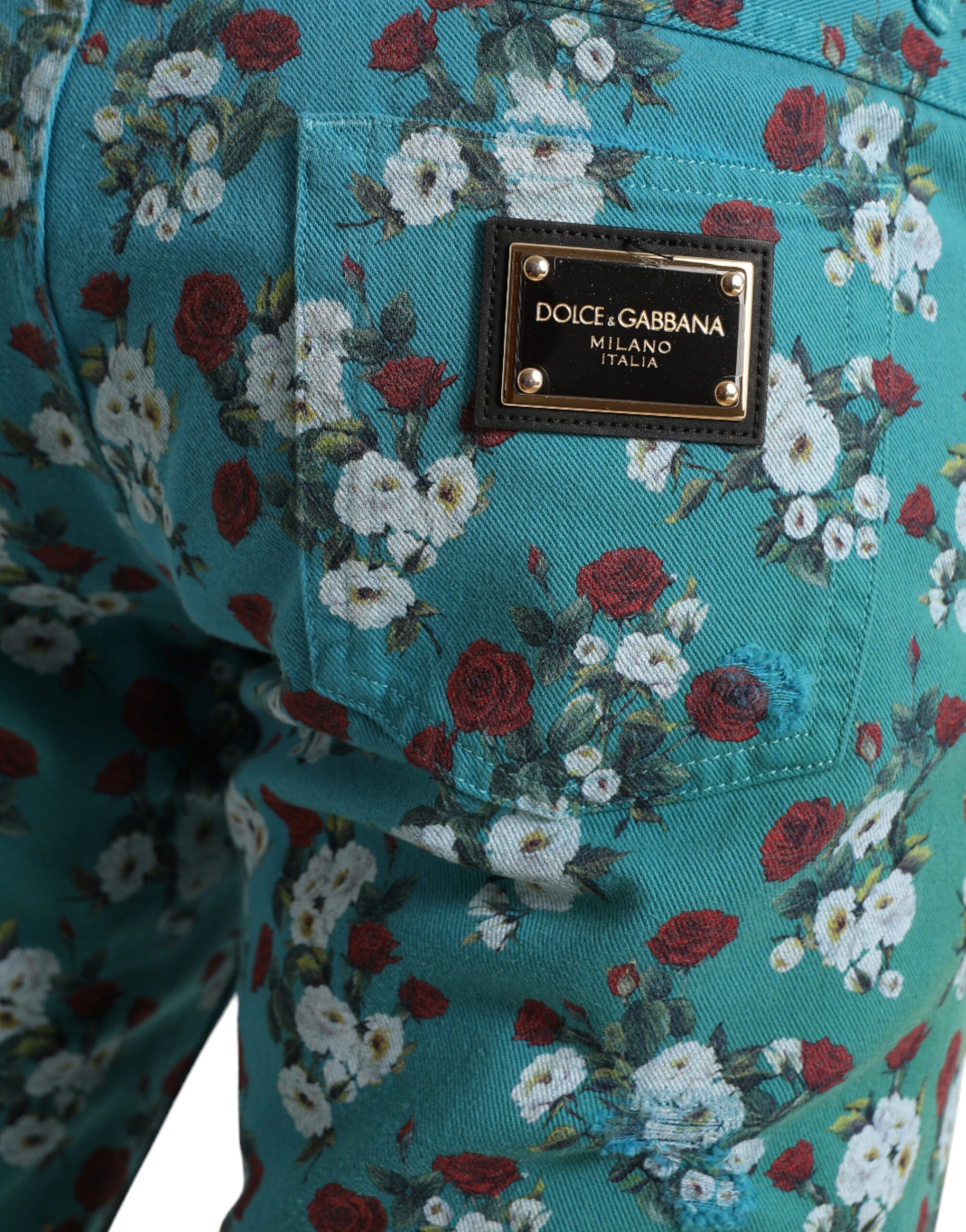Blue floral pants with a D&G logo on the hip