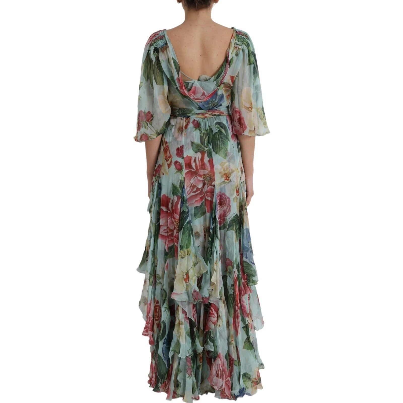 A long blue floral print dress with ruffled sleeves and a tiered skirt