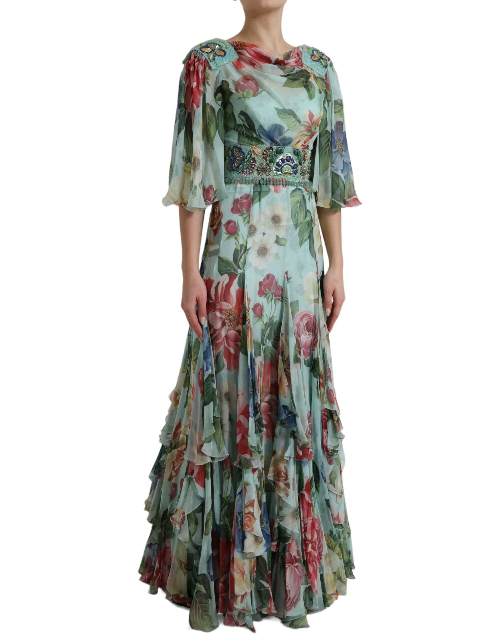 A long blue floral print dress with tiered ruffles and a belt detail