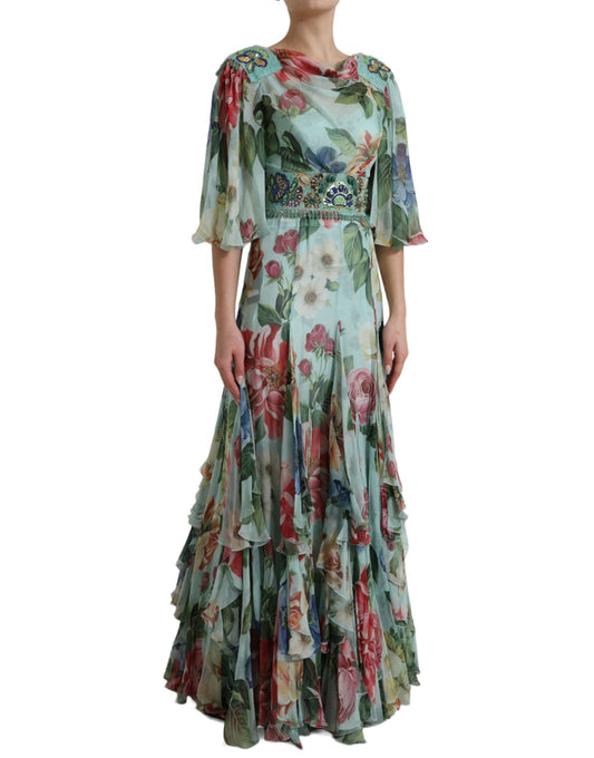 A long blue floral print dress with tiered ruffles and a belt detail