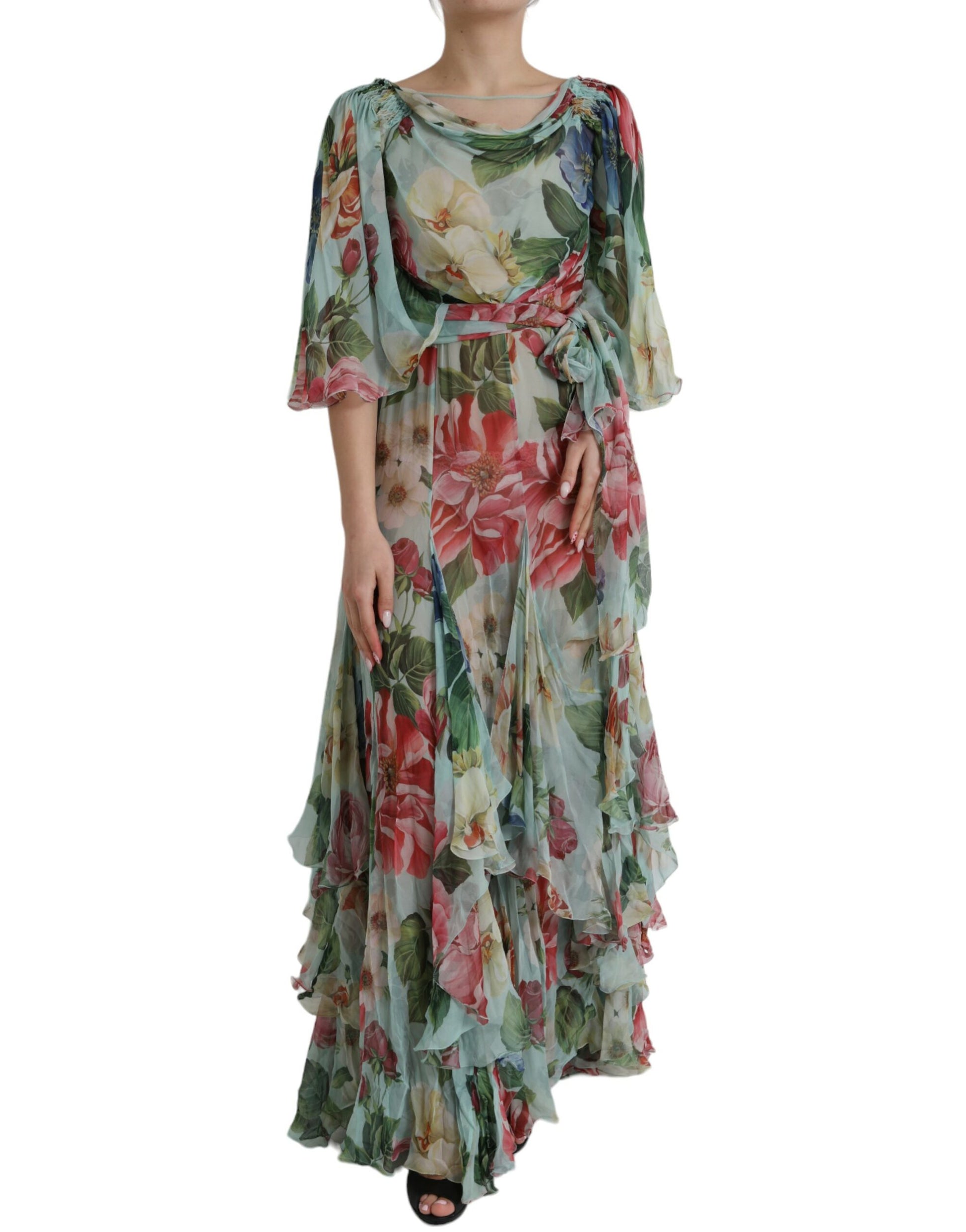 A long blue floral print dress with tiered ruffles and a V-neckline