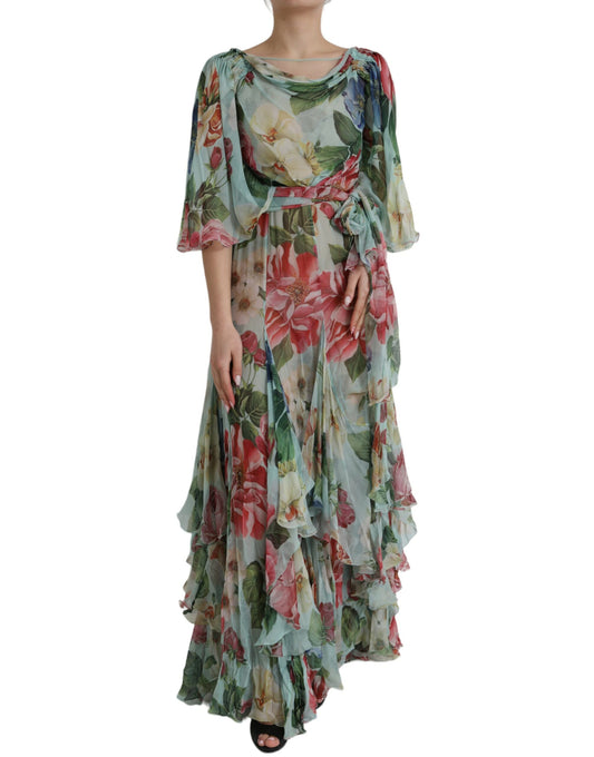 A long blue floral print dress with tiered ruffles and a V-neckline