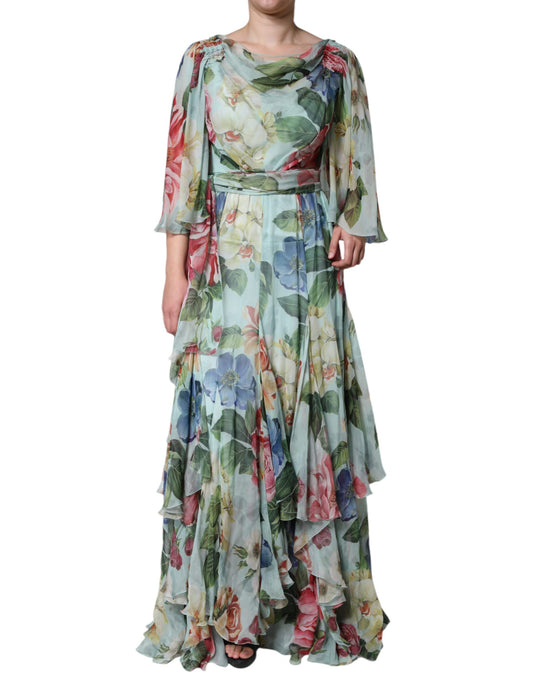 A long blue floral print dress with tiered ruffles and a belted waist