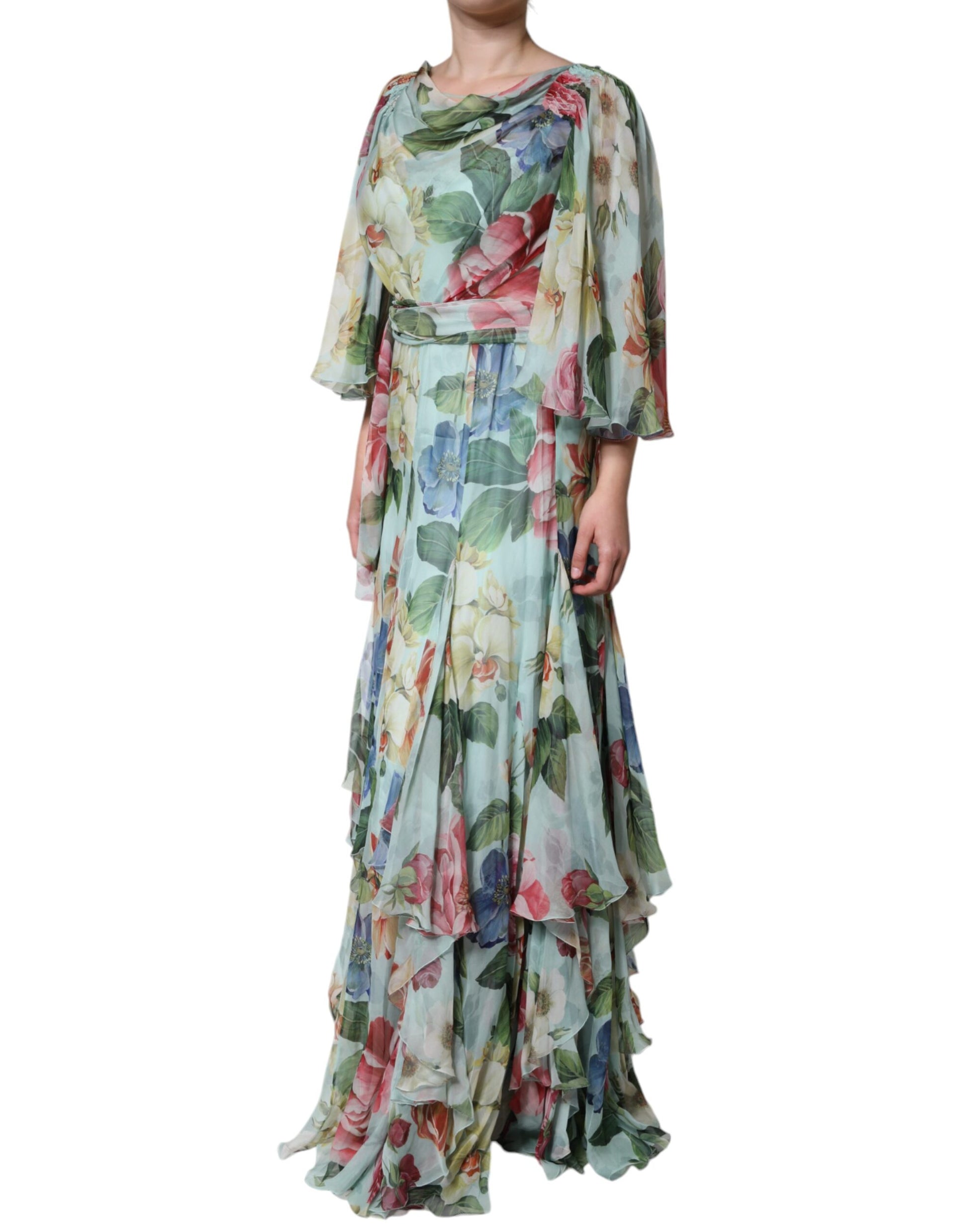 A long blue floral print dress with tiered ruffles and a flowing skirt