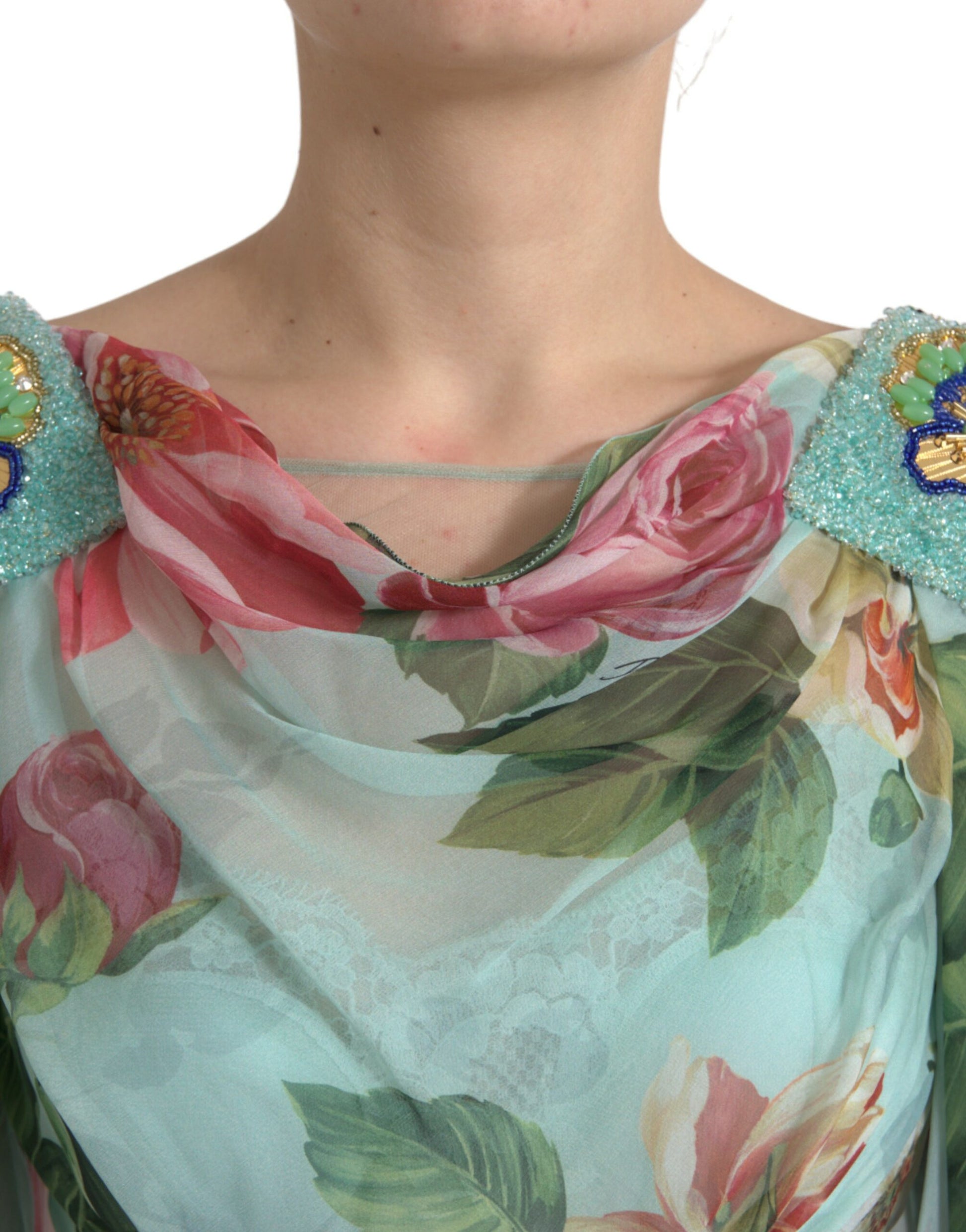 A woman wearing a blue floral print tiered long maxi dress with ruffled sleeves