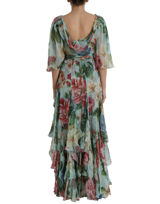 A long blue floral print dress with tiered ruffles and a V-neckline