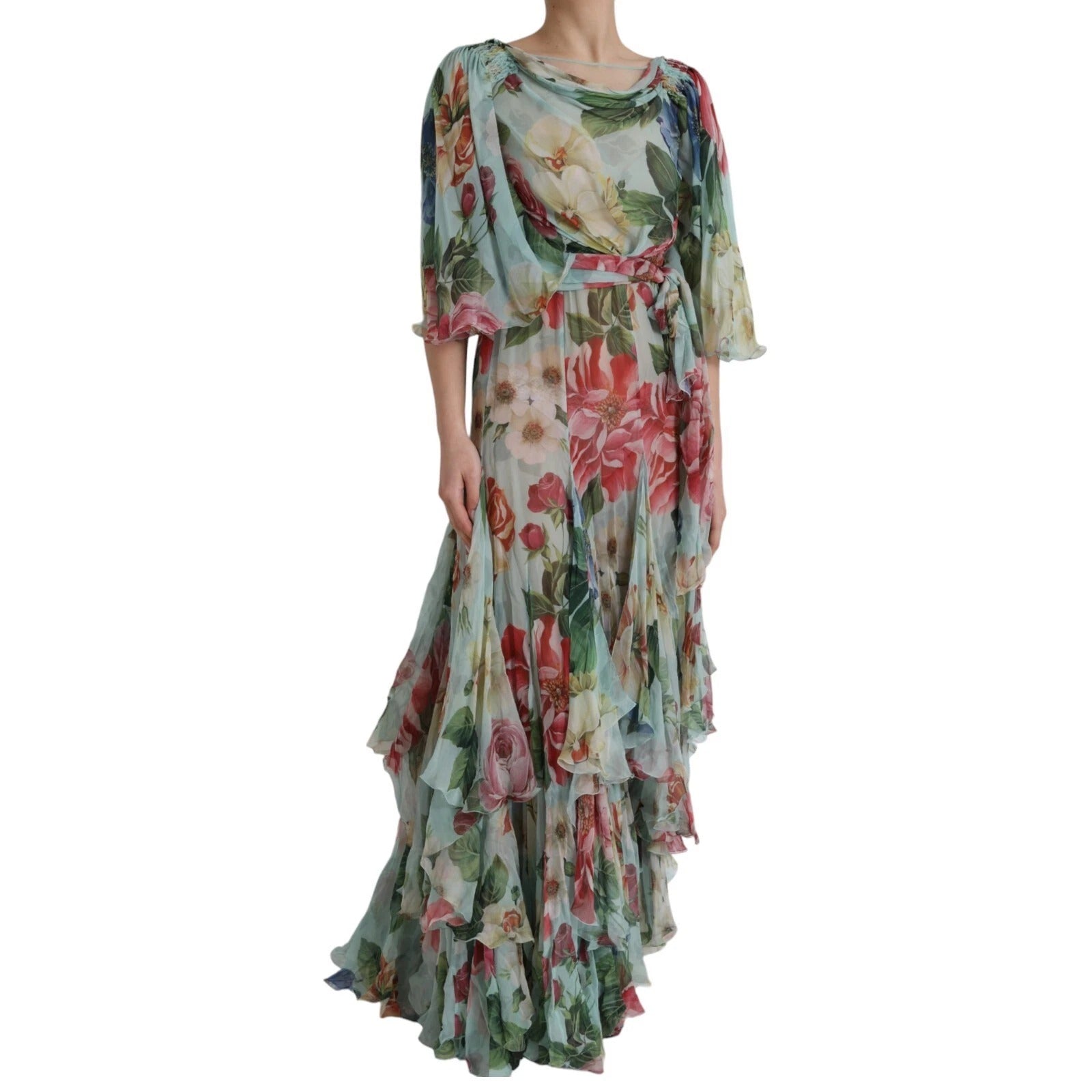 A long blue floral print dress with tiered ruffles and a flowing skirt