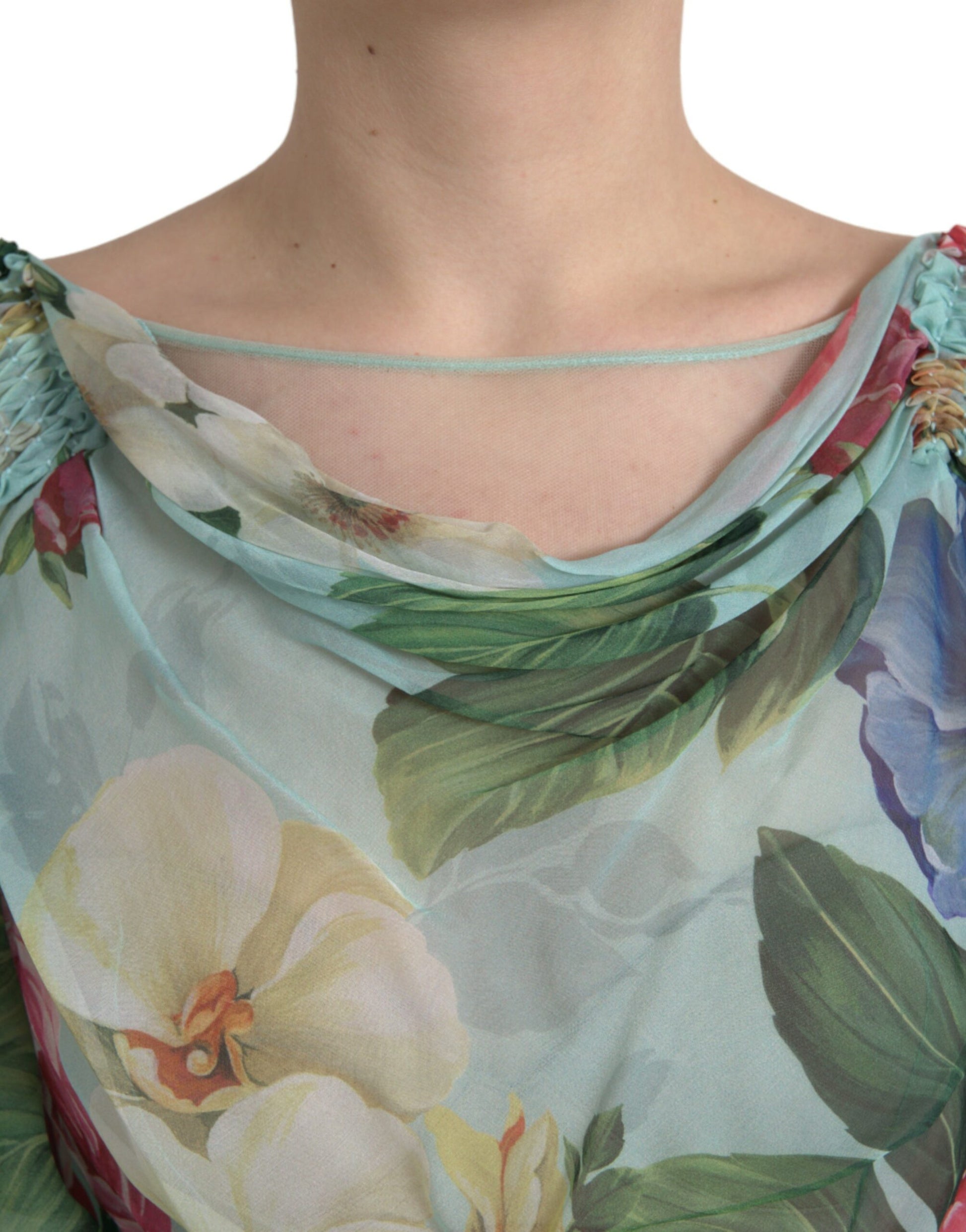 A blue floral print tiered long maxi dress with a V-neckline and short sleeves