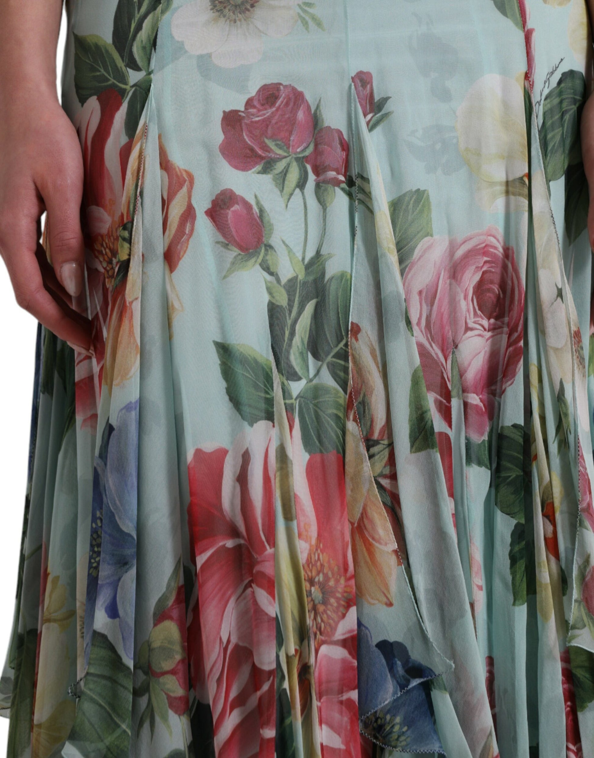 A long blue floral print dress with tiered skirt and ruffled hem