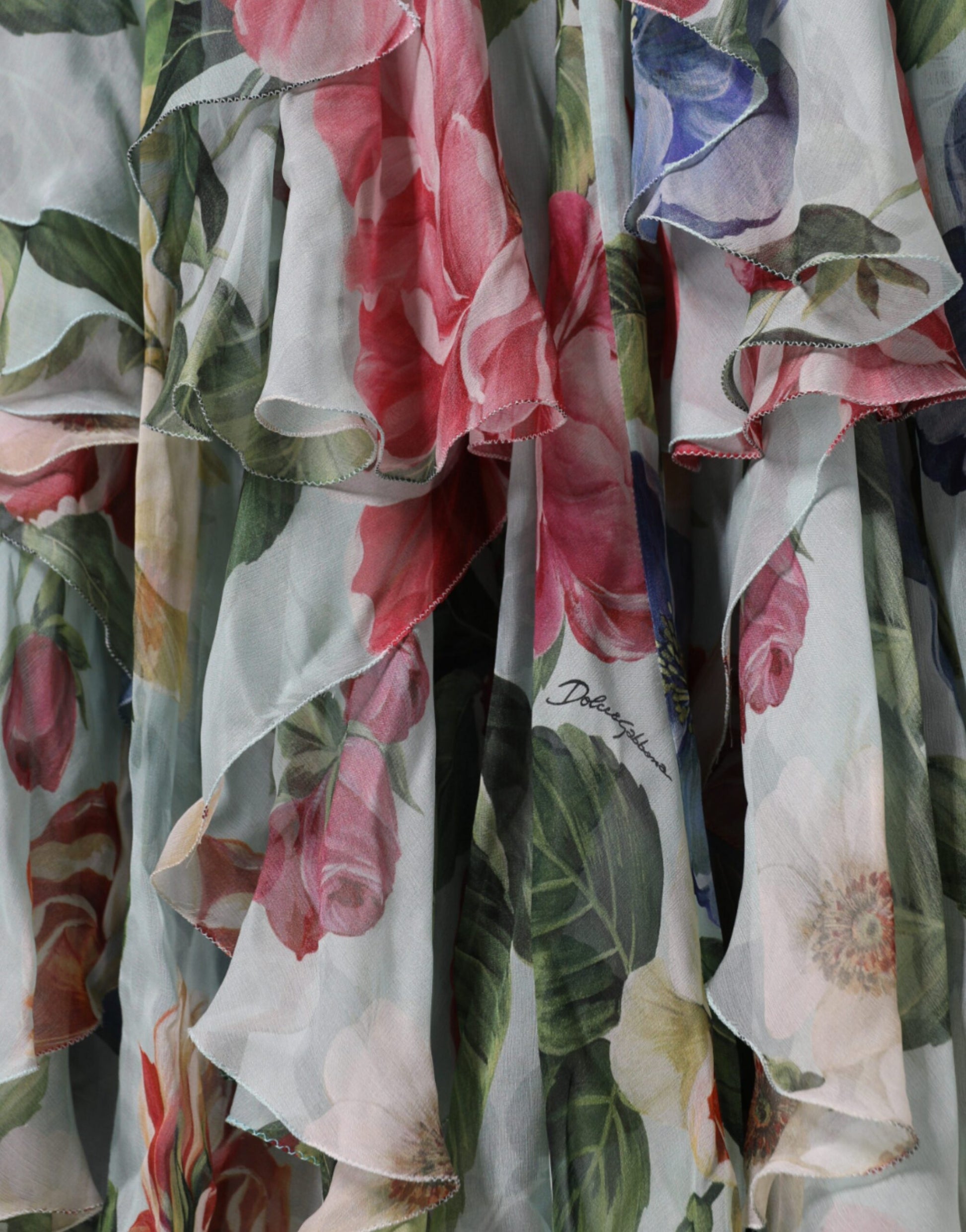 A blue floral print tiered long maxi dress with ruffled sleeves and hem