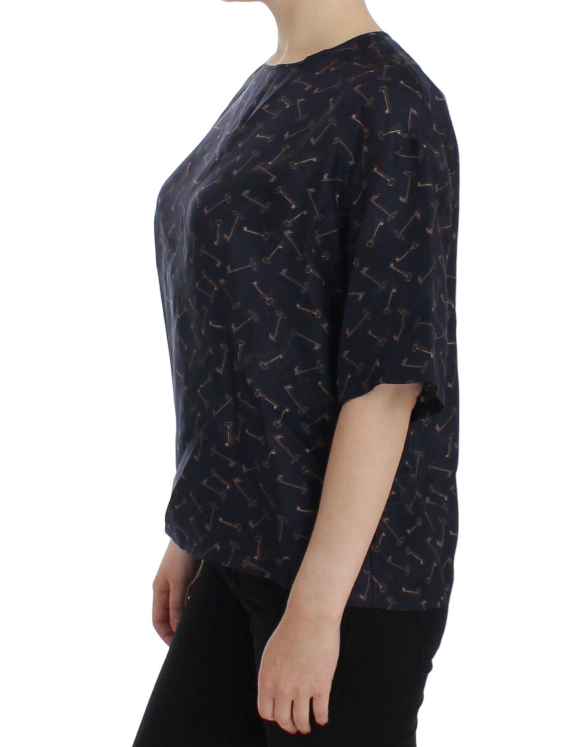 Woman wearing a short sleeve top with a patterned design