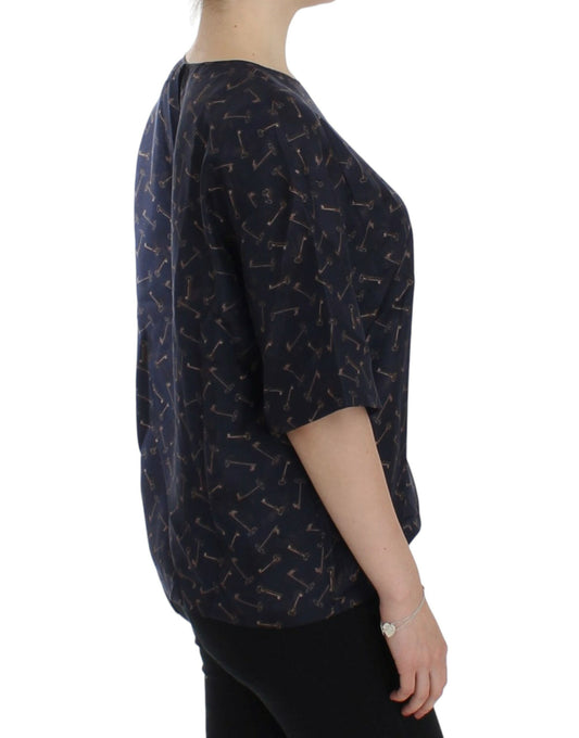 Woman wearing a dark blue top with patterned sleeves