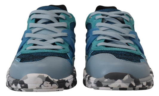 Pair of blue and white sneakers with laces tied in a bow