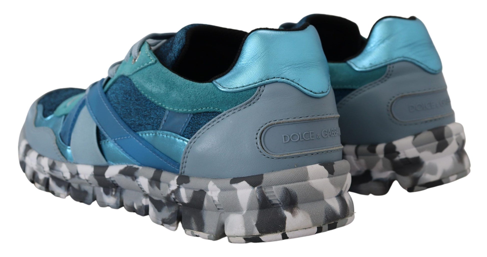 Pair of blue and white sneakers with black laces