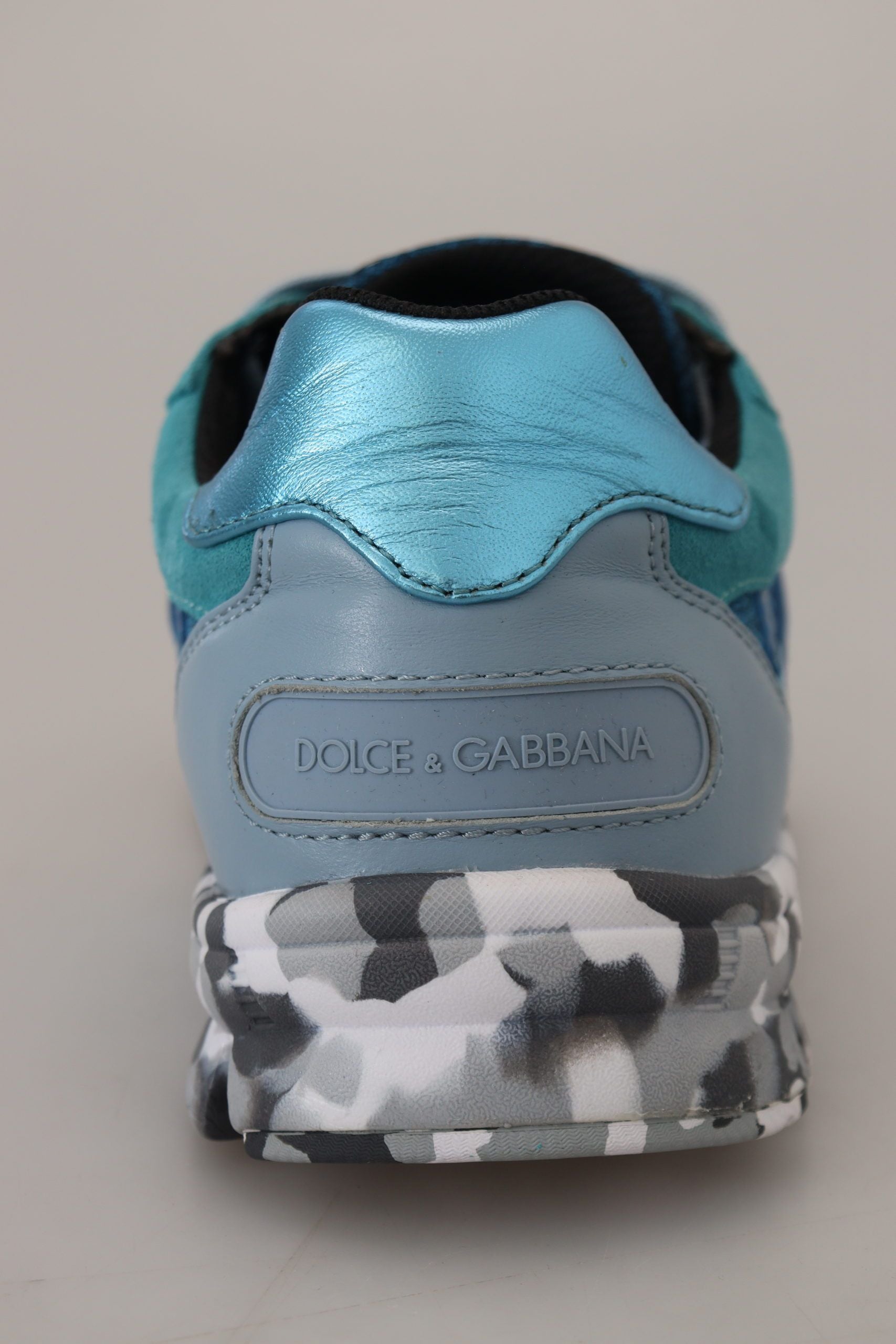 Blue and white sneaker with black laces