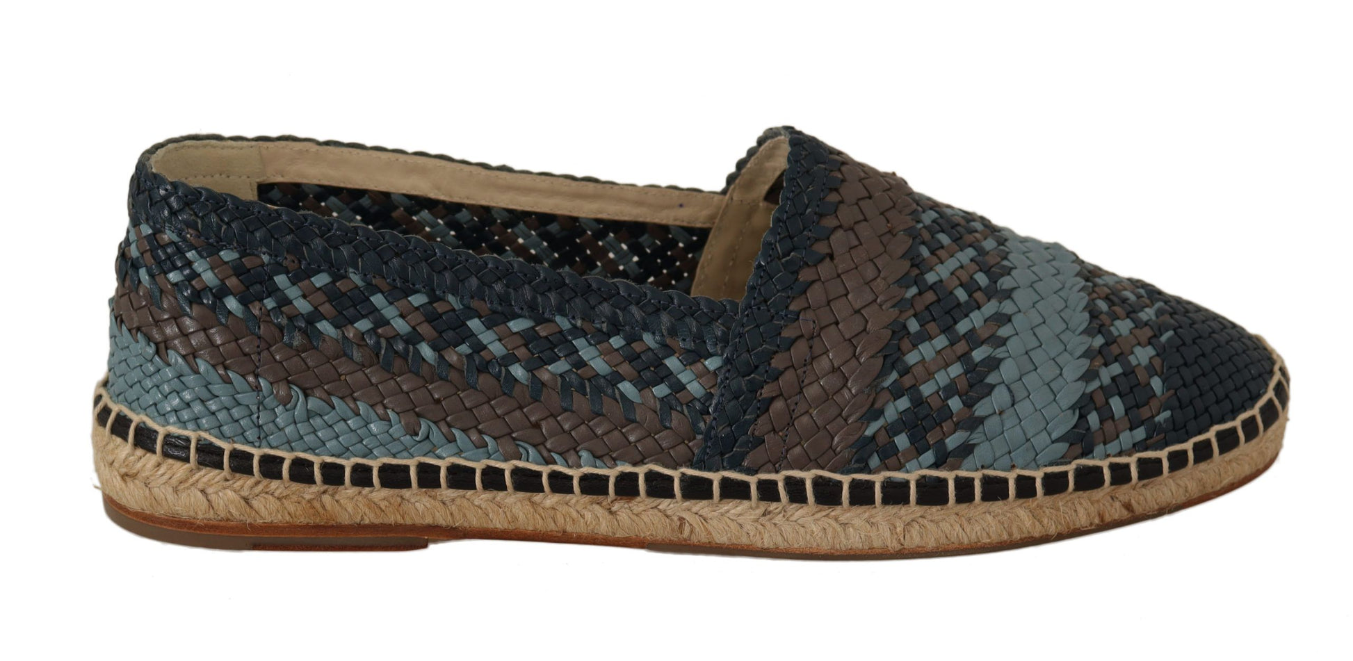 A single shoe against a neutral background. It is a casual slip-on style with a patterned upper featuring blue and brown