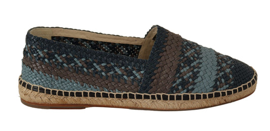 A single shoe against a neutral background. It is a casual slip-on style with a patterned upper featuring blue and brown