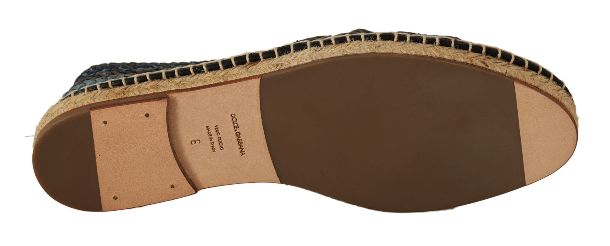 Brown leather shoe with stitching details and a visible sole