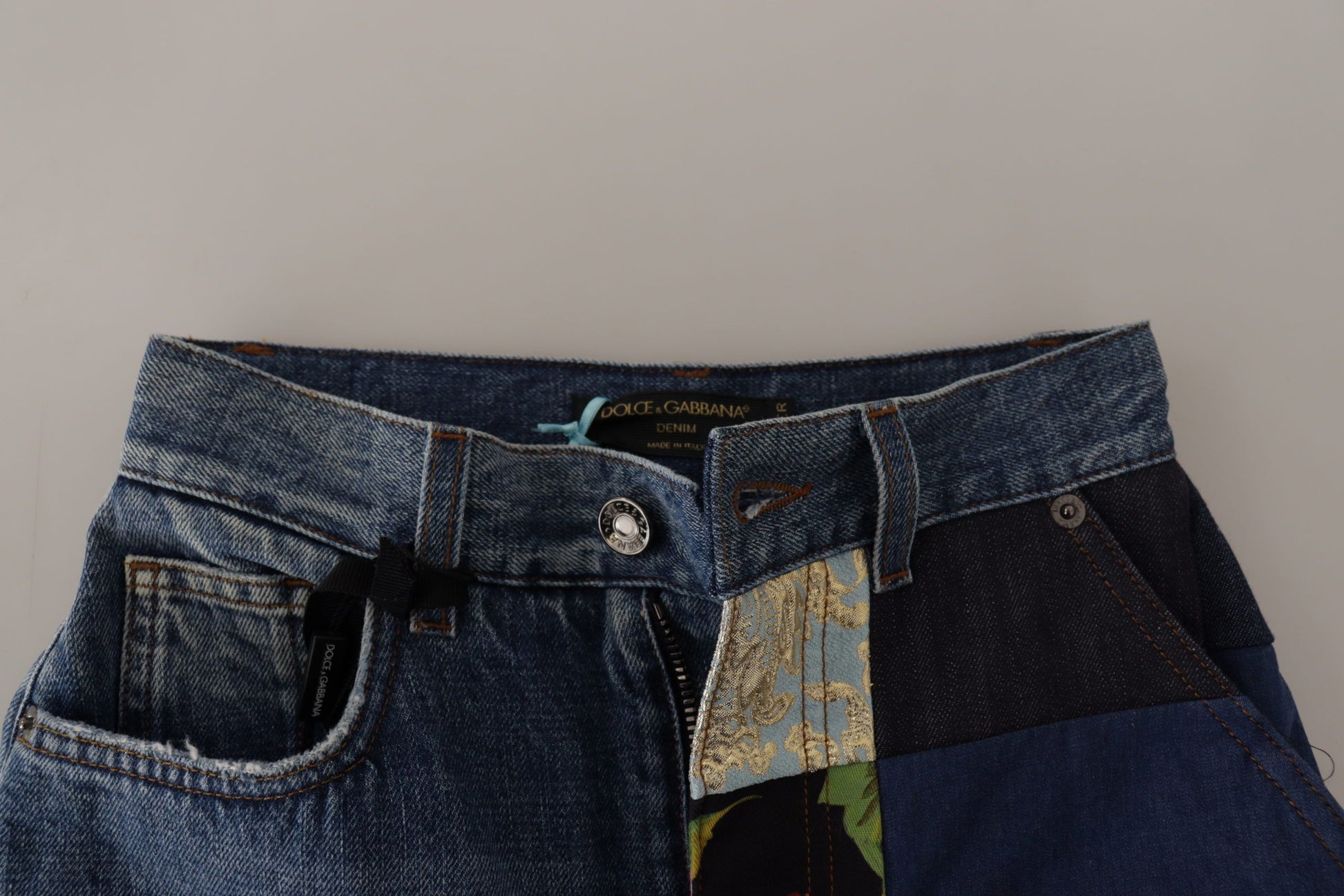 Pair of blue jeans with a patch on the right leg