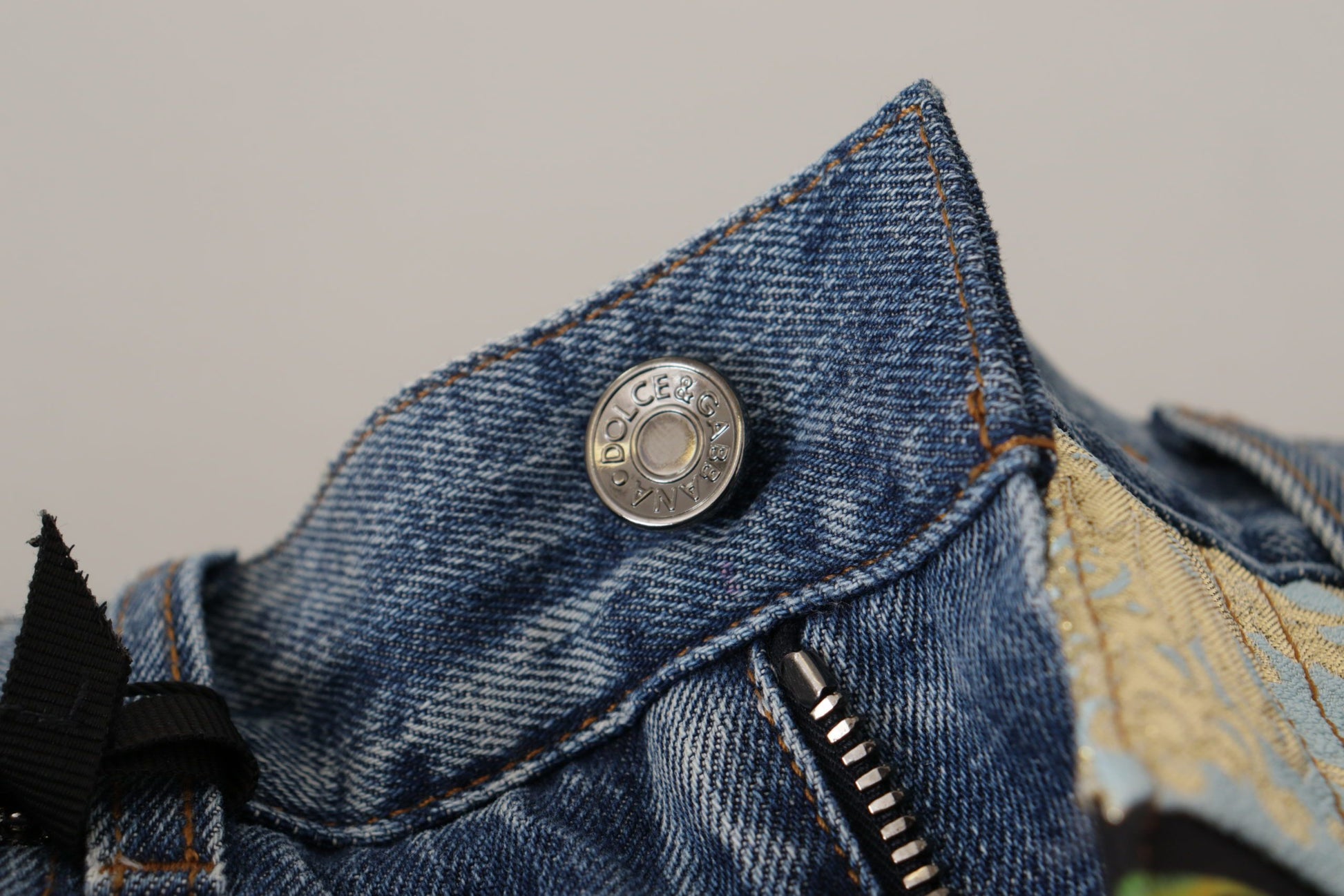 Denim jeans with button closure
