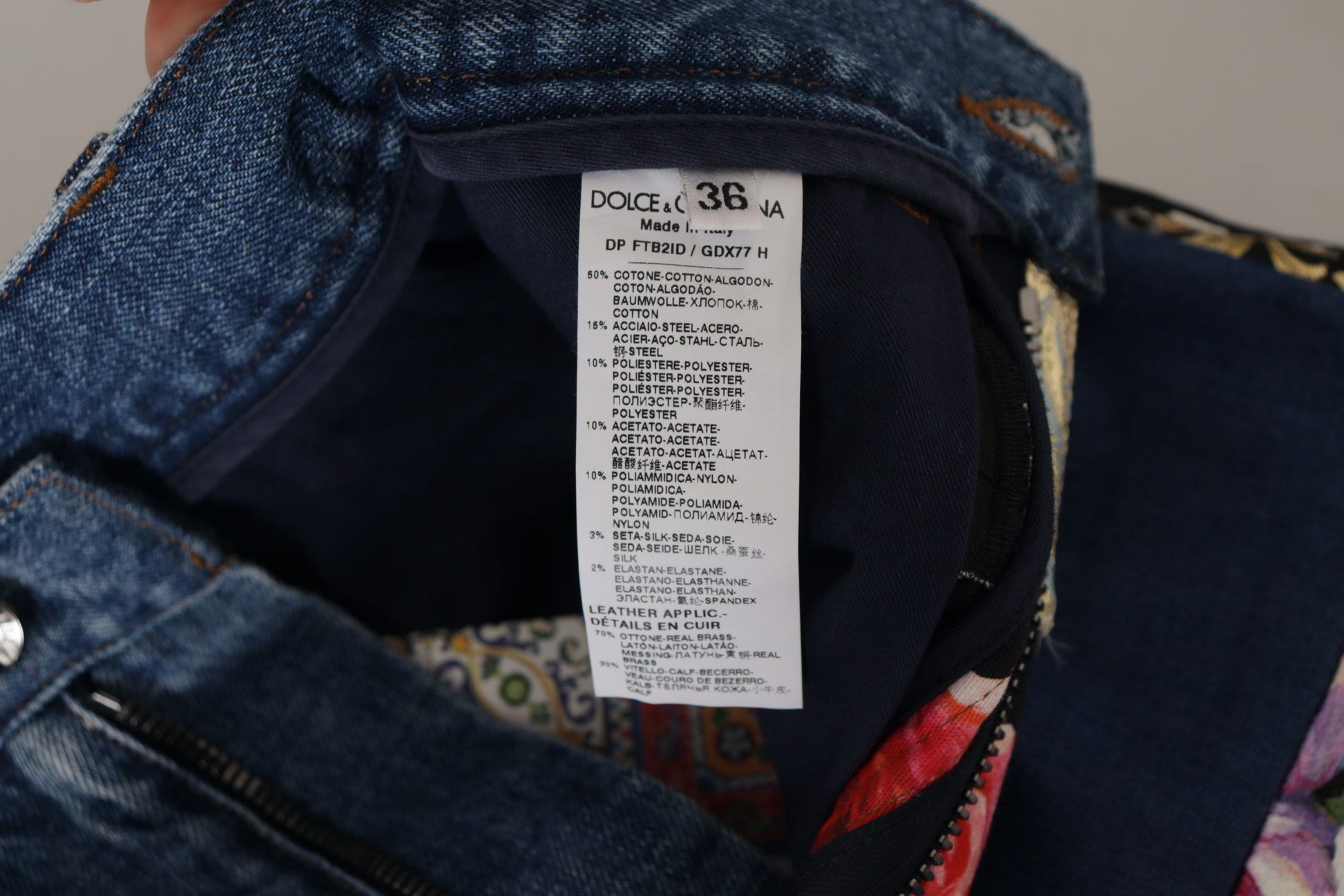Blue jeans with a white label inside the waistband